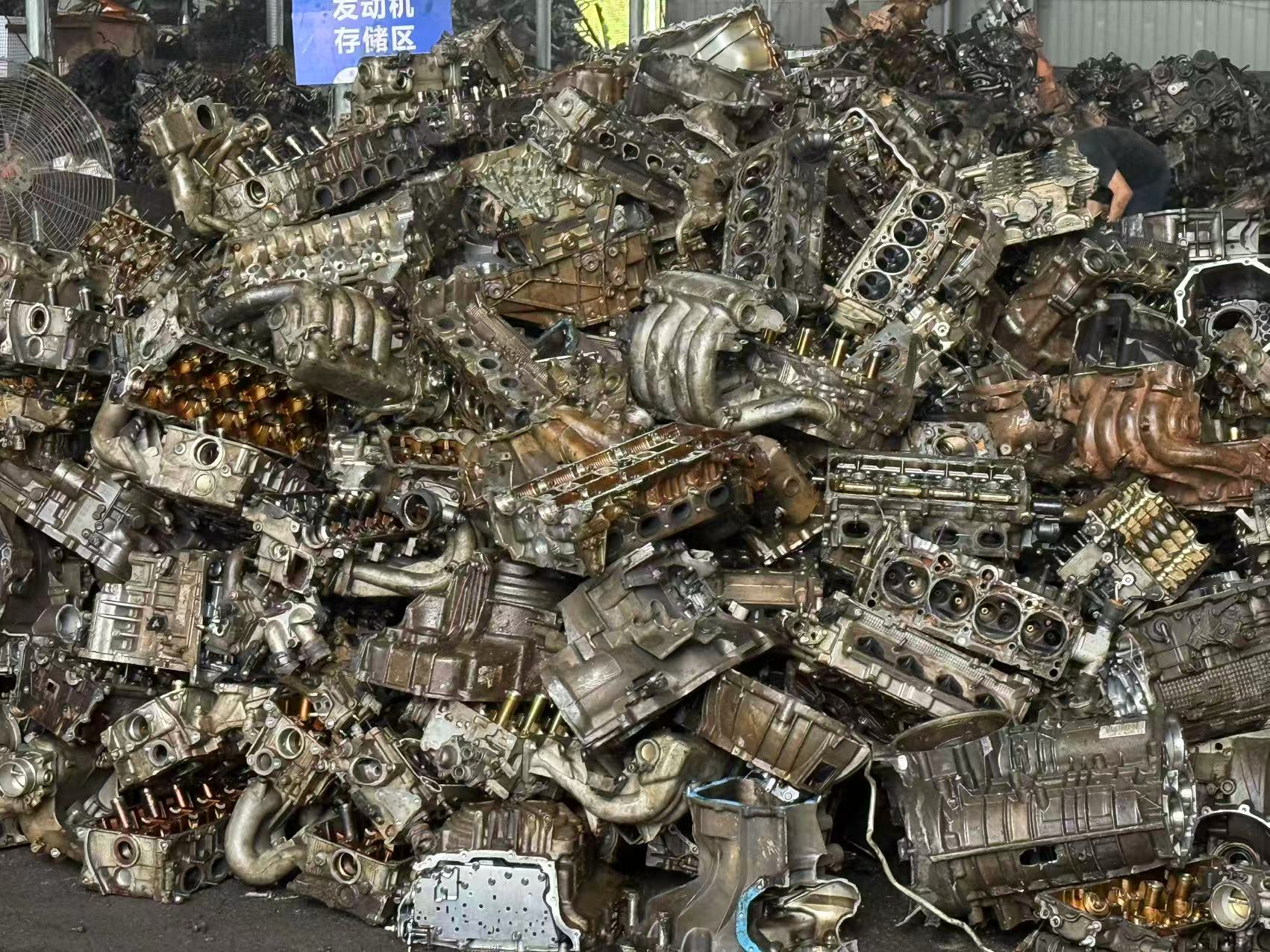 Engine and transmission scrap stored in a warehouse