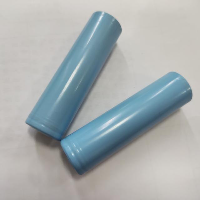 Graded single lithium cell displayed on white background